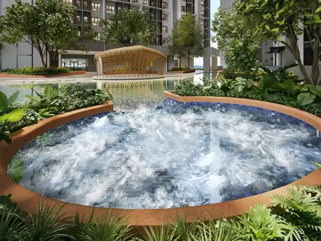 Round jacuzzi pool surrounded by tropical planting