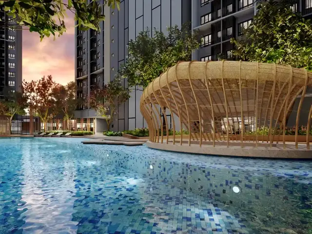 Swimming pool with a woven timber pavilion at dusk